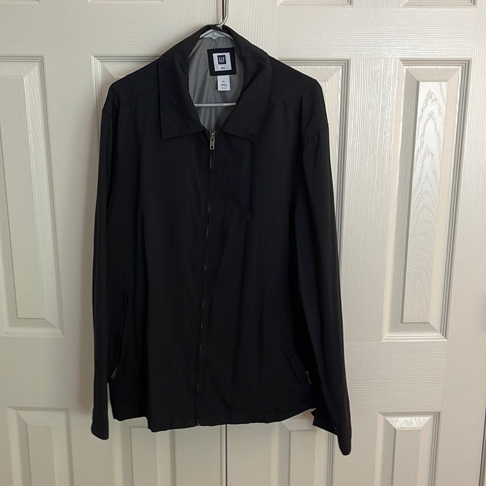 Lightweight semi dress coat that is black.